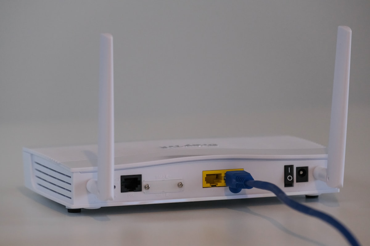 A technician cabling network equipment in a server rack